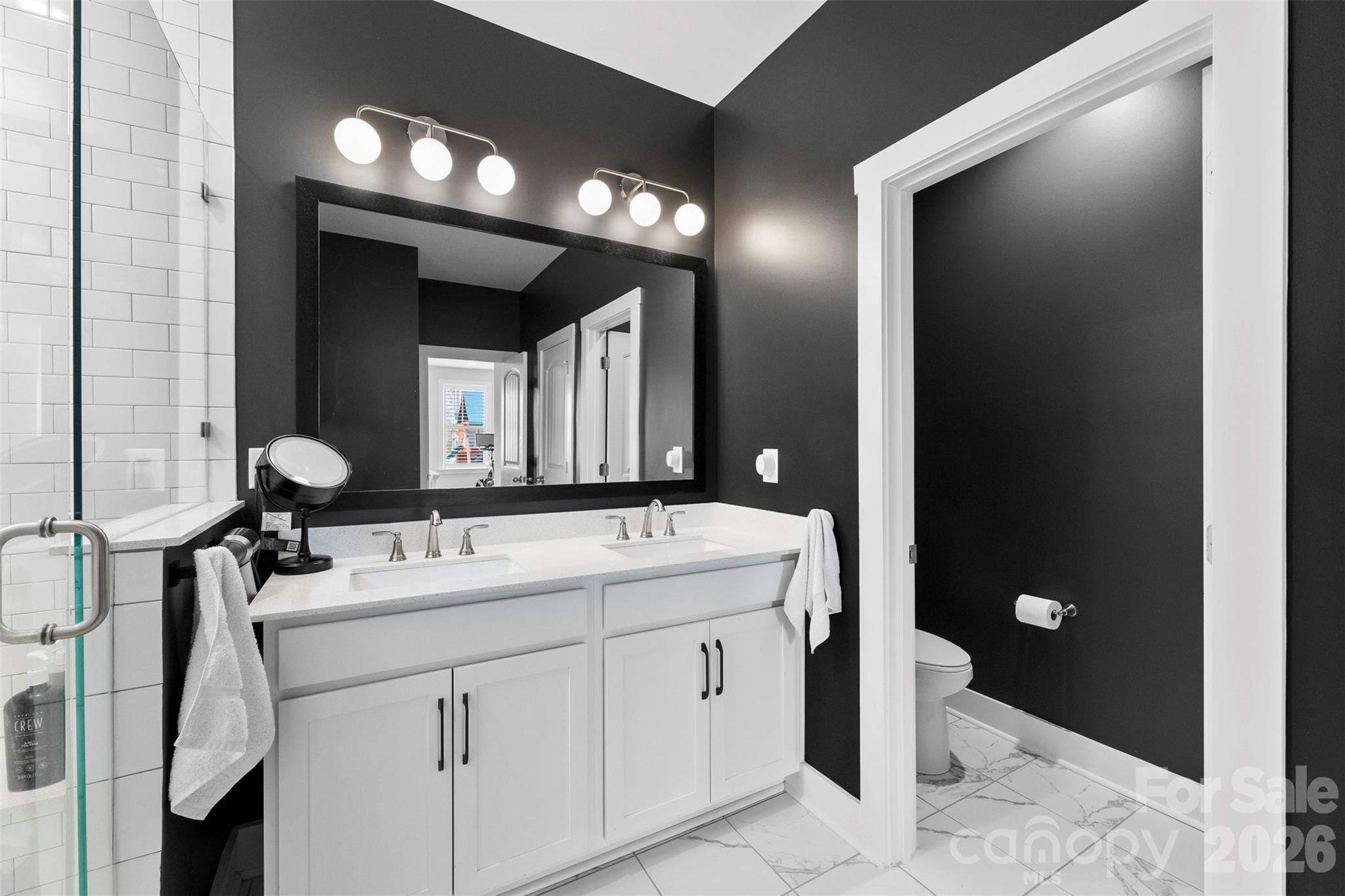 6283 Six String Court Fort Mill, SC 29708 - Photo 20 of 40 a bathroom with a double vanity sink and a mirror