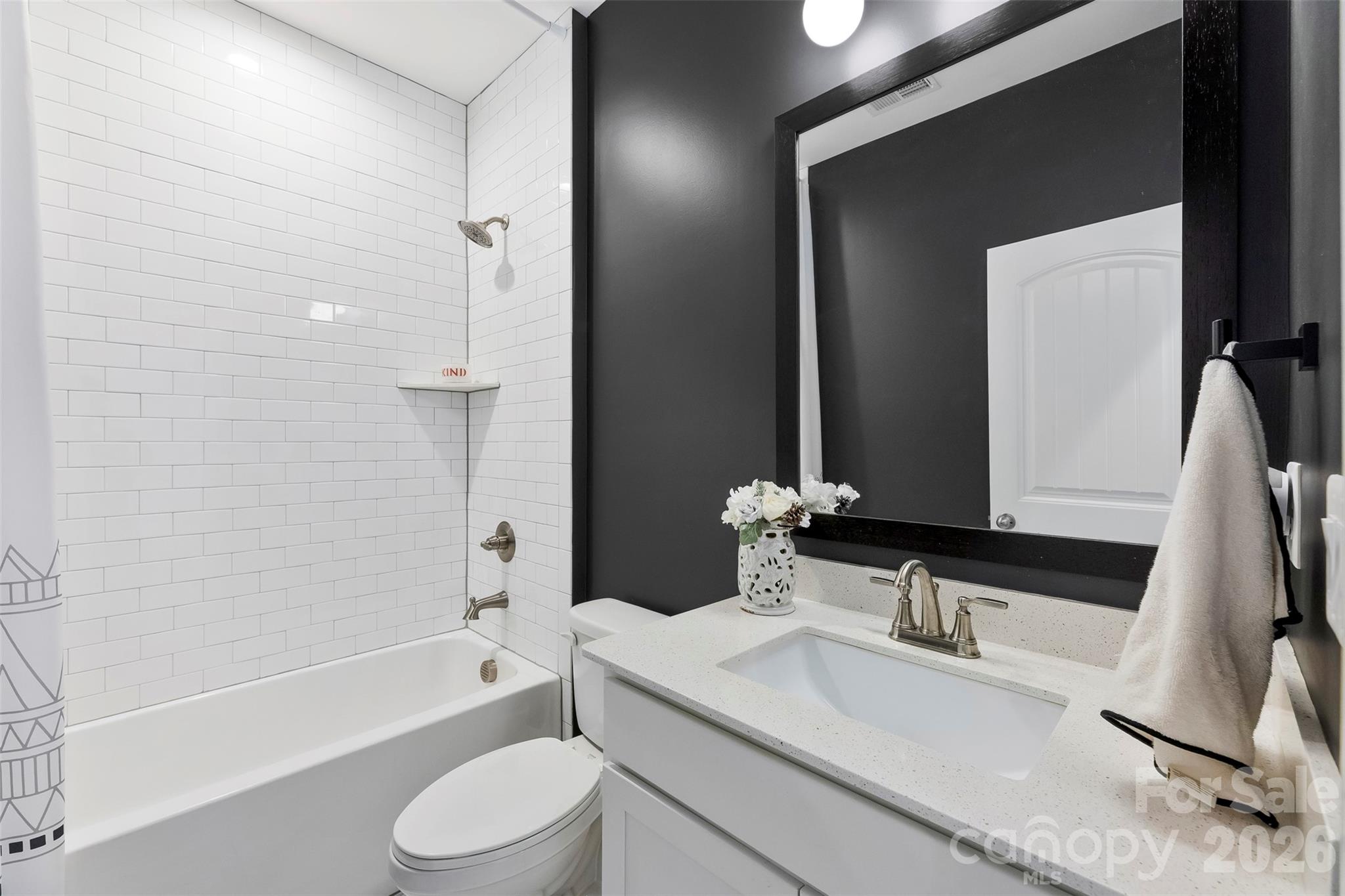 6283 Six String Court Fort Mill, SC 29708 - Photo 21 of 40 a bathroom with a granite countertop sink toilet and shower