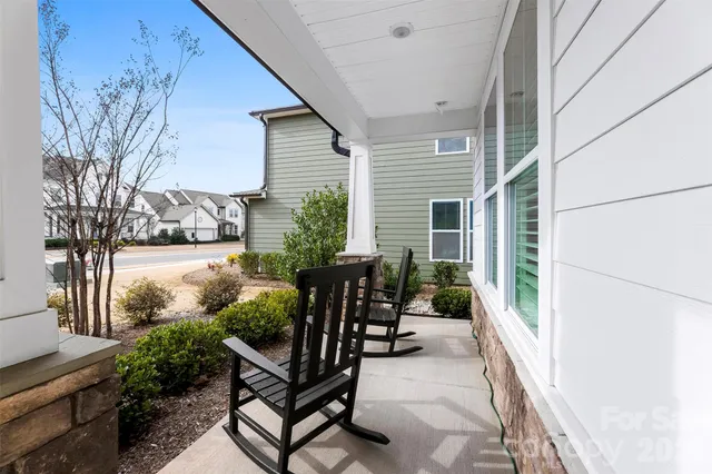 a living room with furniture a window and a fireplace