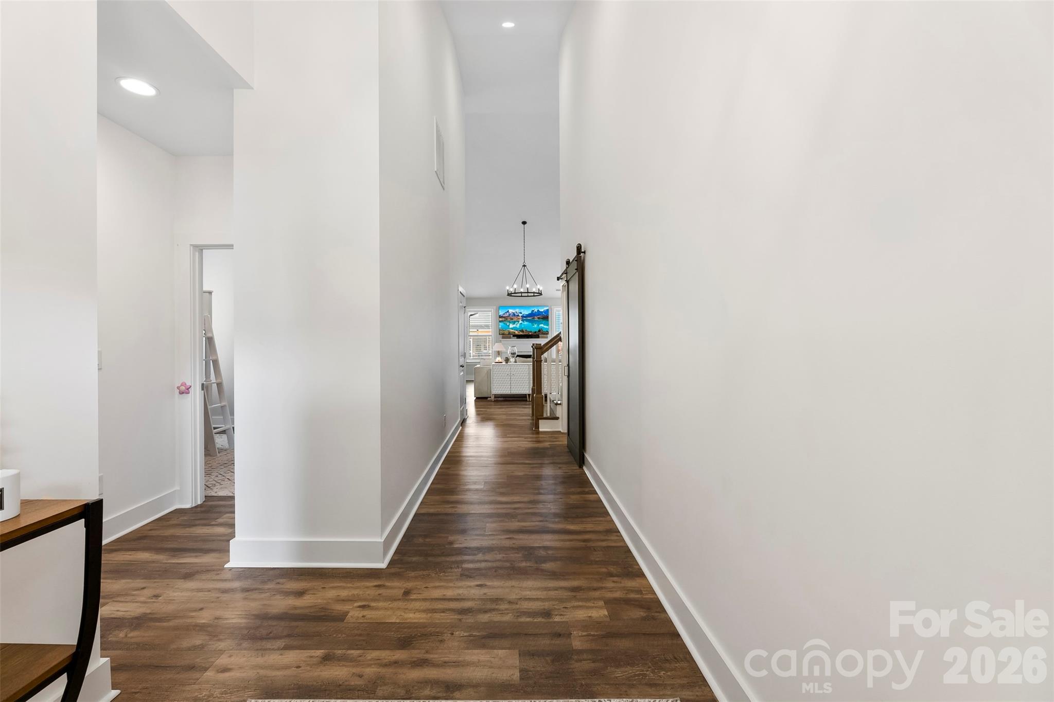 6283 Six String Court Fort Mill, SC 29708 - Photo 7 of 40 a view of a hallway with wooden floor