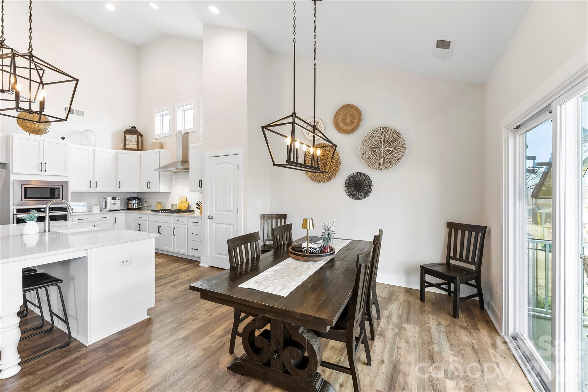 6283 Six String Court Fort Mill, SC 29708 - Photo 9 of 40 a view of kitchen and dining room with wooden floor