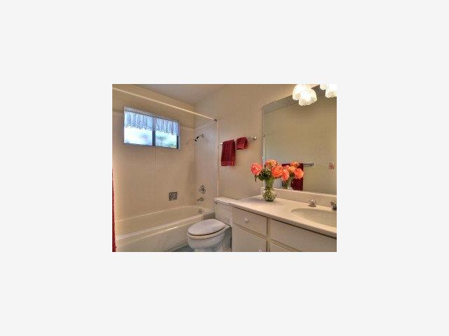 1925 Amalfi Way Mountain View, CA 94040 - Photo 7 of 9 a bathroom with a toilet a sink and mirror