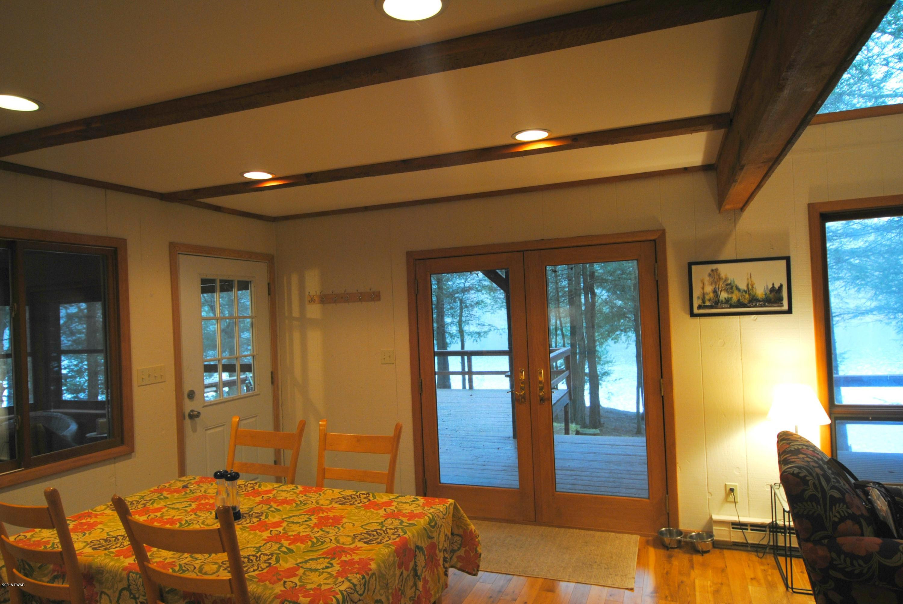 3036 Northgate Road Lake Ariel, PA 18436 - Photo 7 of 26 a bedroom with a large bed and wooden floor