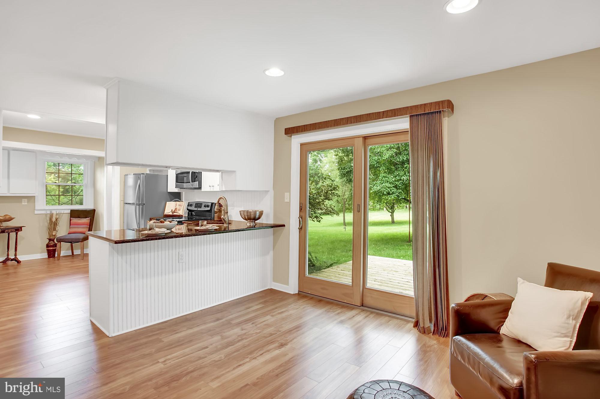 910 Limekiln Road Doylestown, PA 18901 - Photo 7 of 32 Sliding glass door to deck & lush side yard
