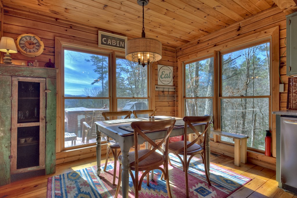 468 Conley Branch Road Blue Ridge, GA 30513 - Photo 5 of 20 a dining room with furniture and large windows