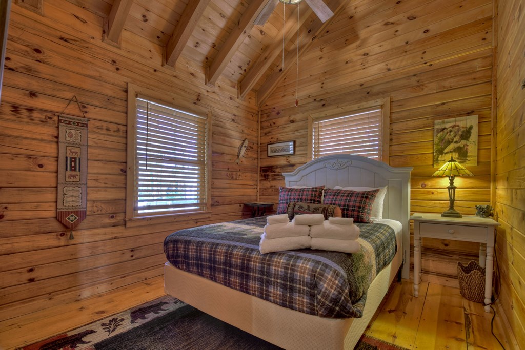 468 Conley Branch Road Blue Ridge, GA 30513 - Photo 10 of 20 a bedroom with a bed and a window