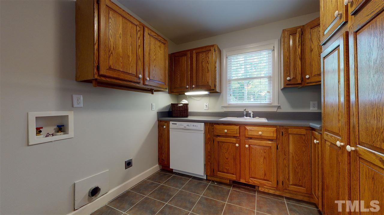 3132 Mt Vernon Church Road Raleigh, NC 27613 - Photo 21 of 30 Laundry with Tons of Cabinets and Storage. It even has a second washer.