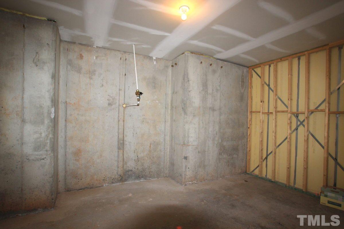 7854 Spungold Street Raleigh, NC 27617 - Photo 15 of 20 Unfinished basement/large storage room!