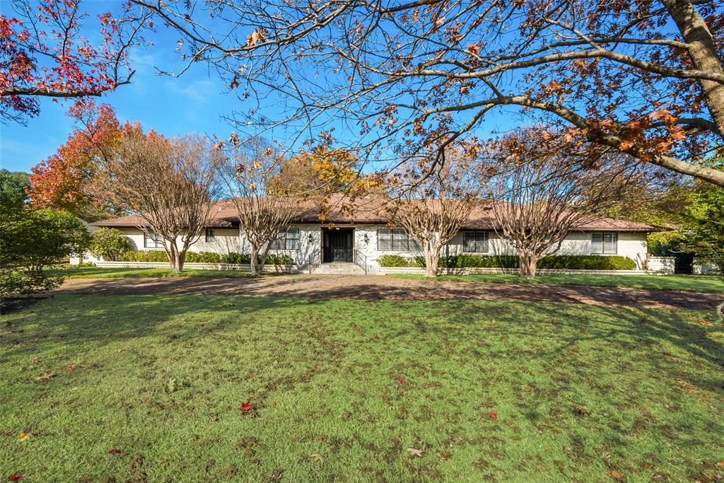 5529 Tanbark Road Dallas, TX 75229 - Photo 1 of 1 a front view of a house with a yard