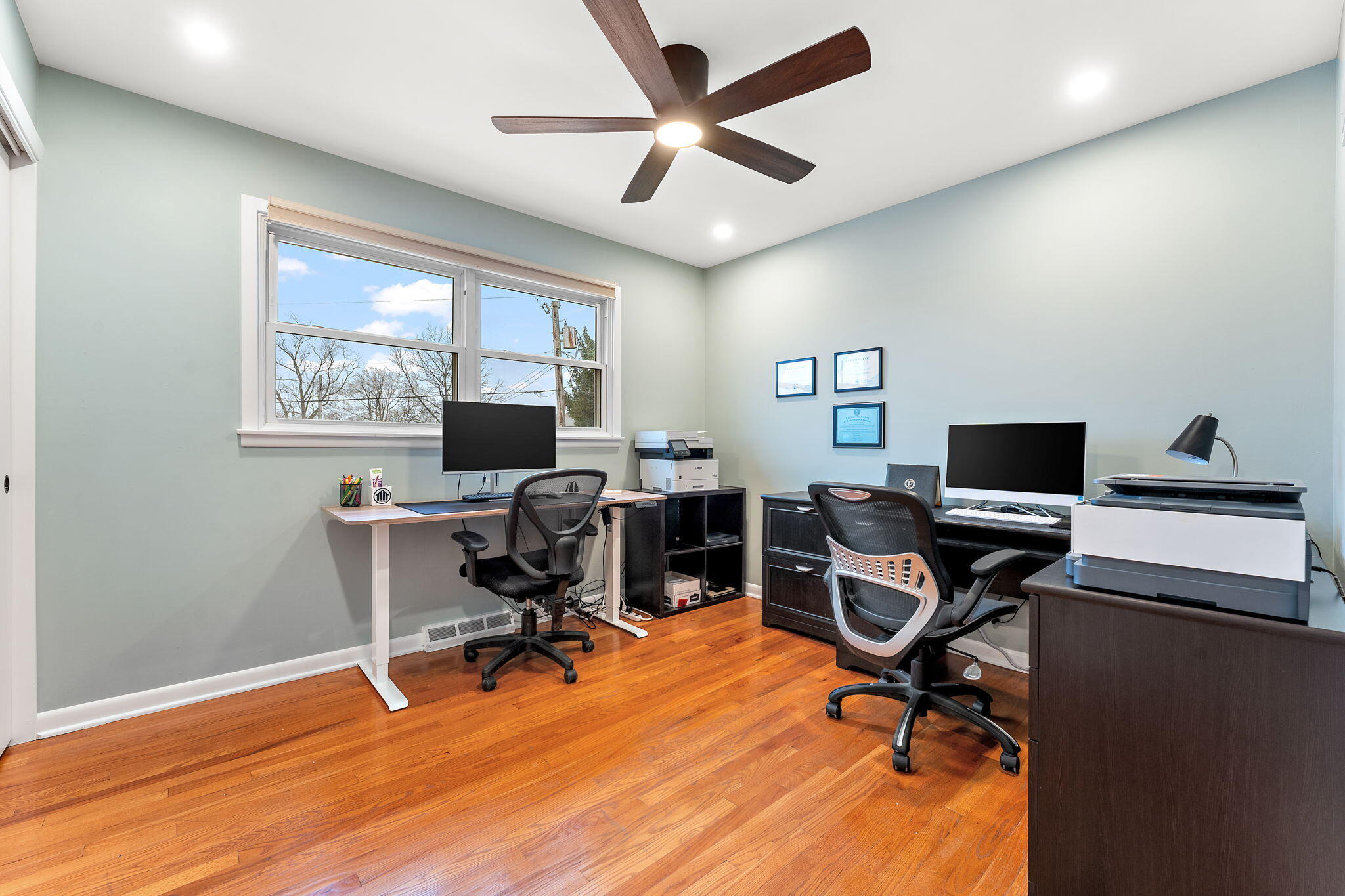 3036 99th Street Highland, IN 46322 - Photo 13 of 22 a view of a workspace with furniture and a window