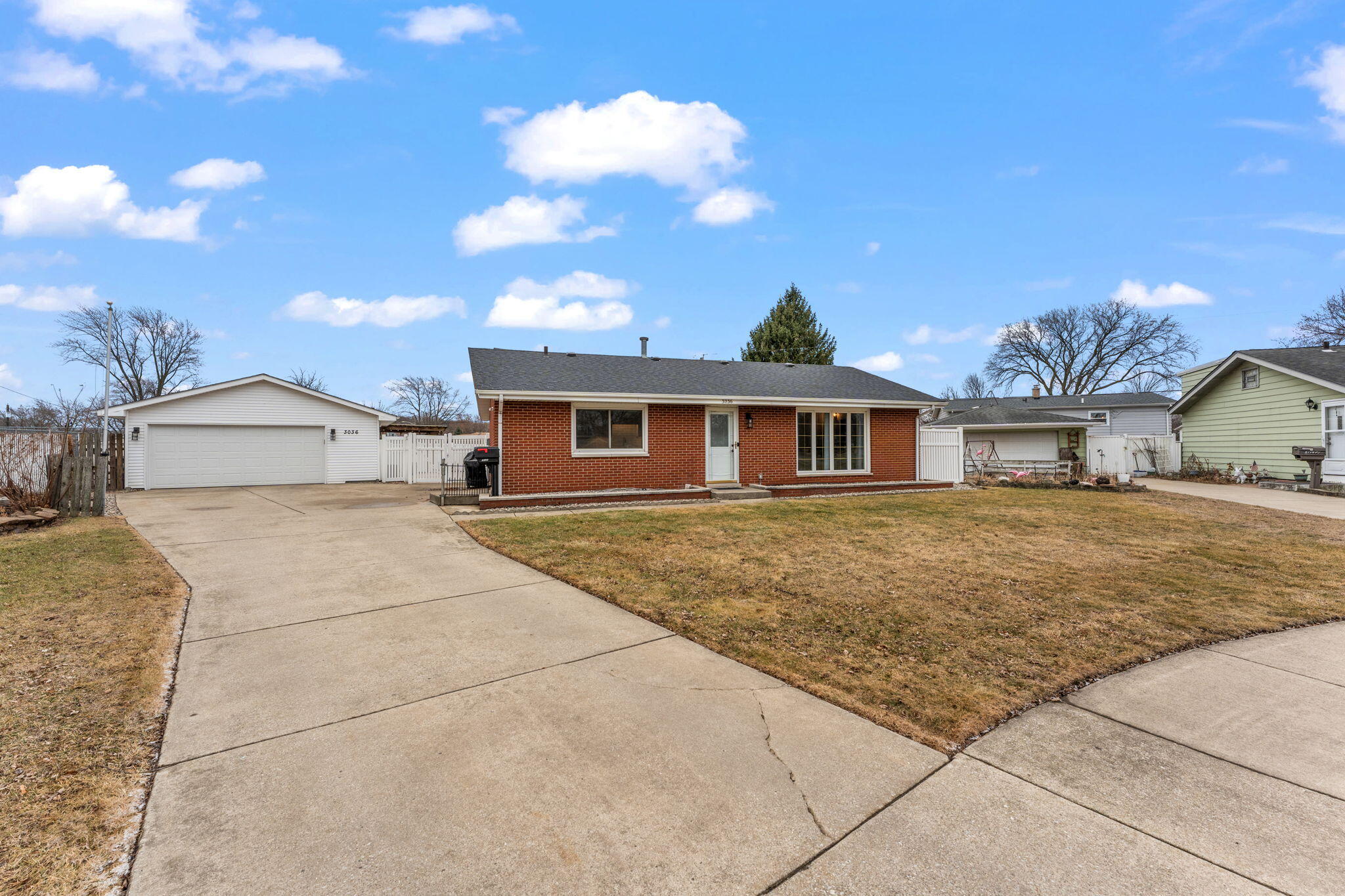 3036 99th Street Highland, IN 46322 - Photo 2 of 22 a front view of a house with a yard
