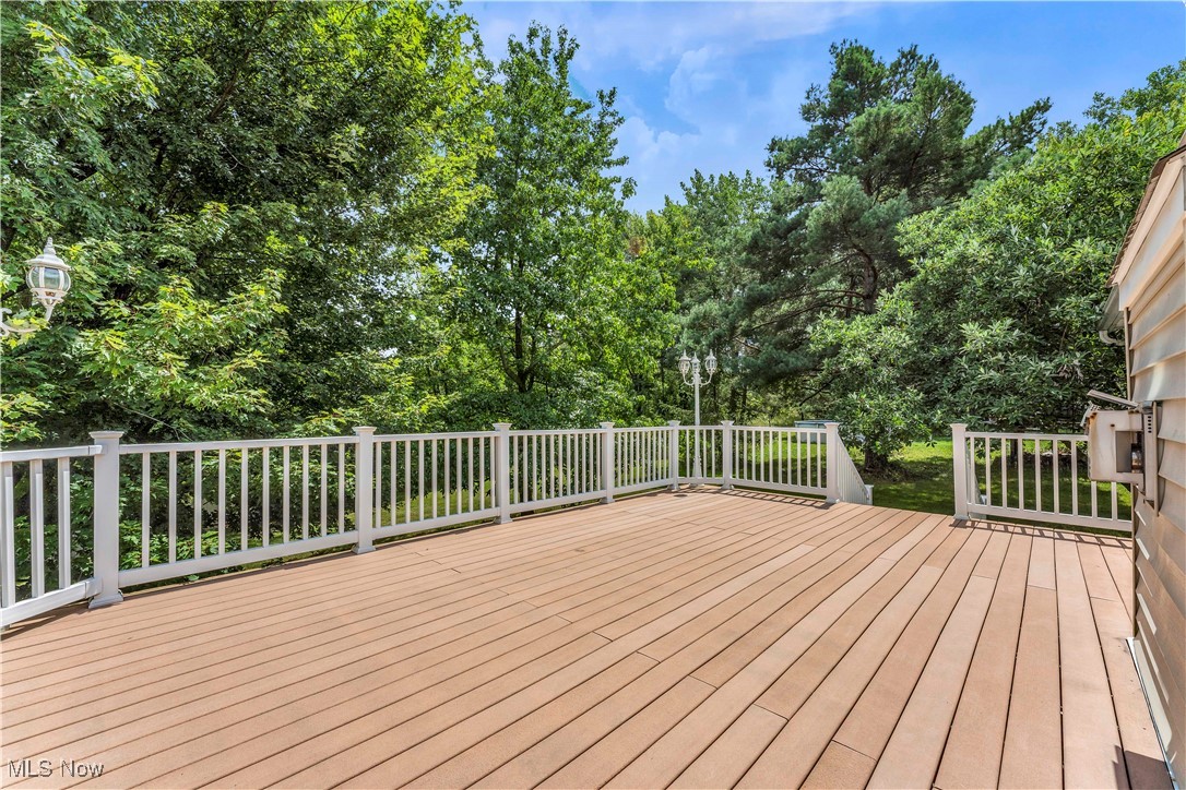 8651 State Road North Royalton, OH 44133 - Photo 24 of 33 Wooden deck featuring view of wooded area