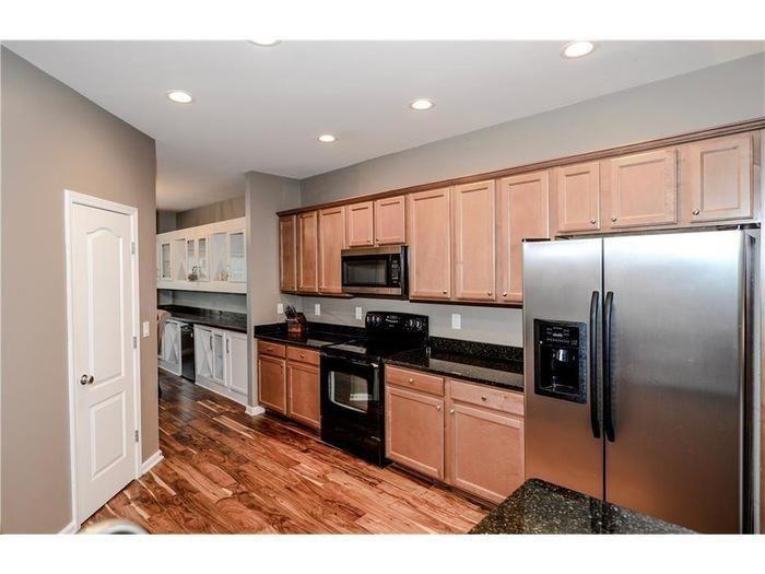 2657 Cedar Drive Lawrenceville, GA 30043 - Photo 11 of 30 a kitchen with stainless steel appliances granite countertop a refrigerator and a stove top oven