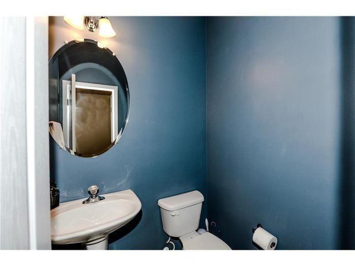 2657 Cedar Drive Lawrenceville, GA 30043 - Photo 15 of 30 a bathroom with a toilet sink vanity and mirror