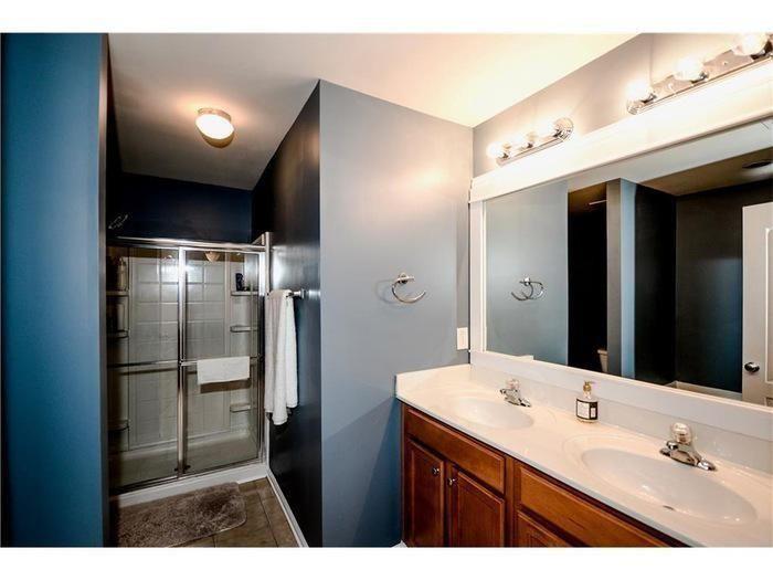 2657 Cedar Drive Lawrenceville, GA 30043 - Photo 20 of 30 a bathroom with a double vanity sink a toilet and a mirror
