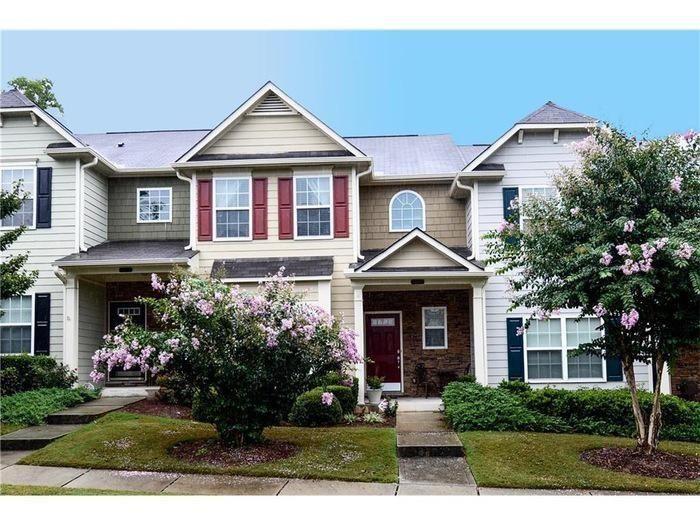 2657 Cedar Drive Lawrenceville, GA 30043 - Photo 2 of 30 a front view of a house with a yard and potted plants