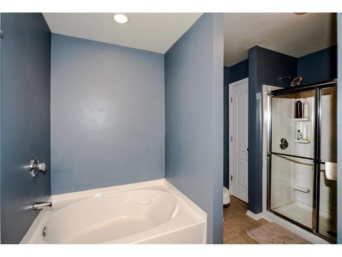 2657 Cedar Drive Lawrenceville, GA 30043 - Photo 22 of 30 a bathroom with a tub and a shower
