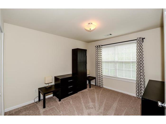 2657 Cedar Drive Lawrenceville, GA 30043 - Photo 25 of 30 a room with furniture and a window