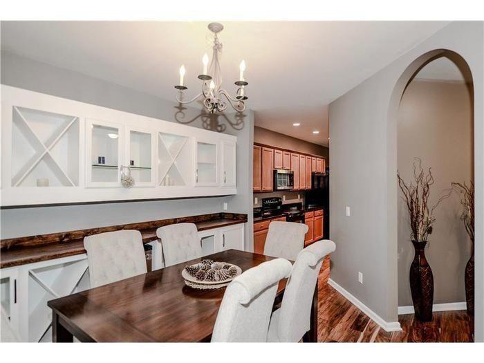 2657 Cedar Drive Lawrenceville, GA 30043 - Photo 8 of 30 a living room with furniture a chandelier and kitchen view