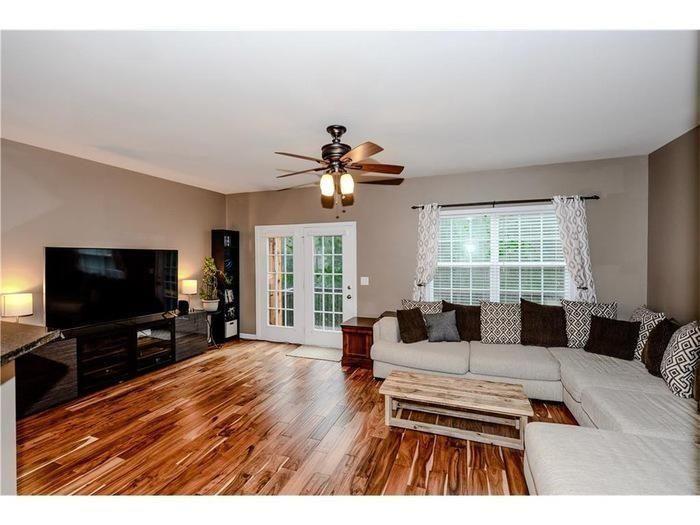 2657 Cedar Drive Lawrenceville, GA 30043 - Photo 10 of 30 a living room with furniture and a flat screen tv