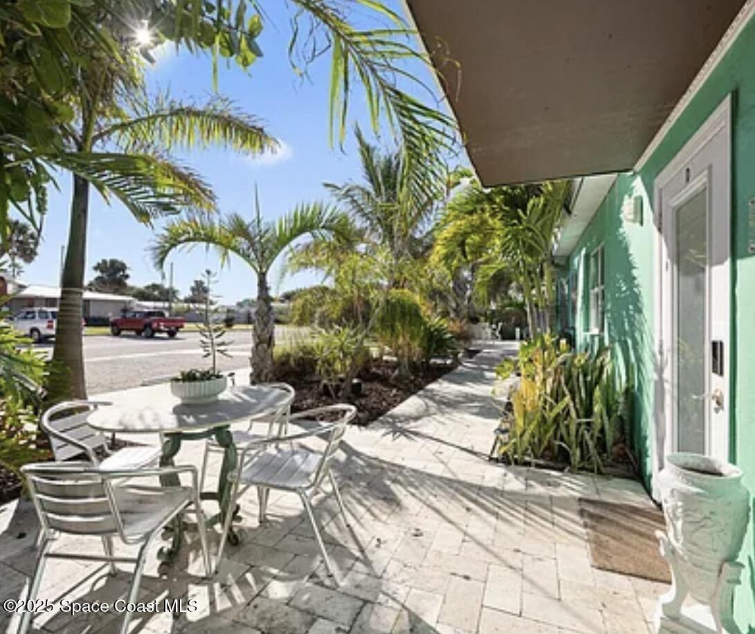 105 Northeast 3rd Street, Unit AD Satellite Beach, FL 32937 - Photo 11 of 27 a view of backyard with swimming pool and furniture