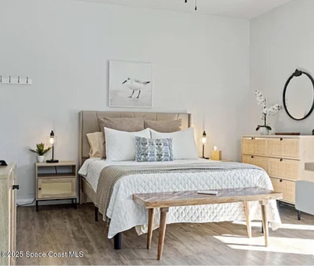 105 Northeast 3rd Street, Unit AD Satellite Beach, FL 32937 - Photo 15 of 27 a bedroom with a bed and window