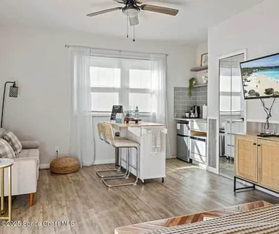 a living room with furniture a window and a table