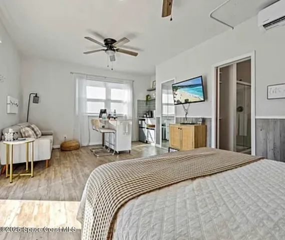 a bedroom with a bed and a mirror