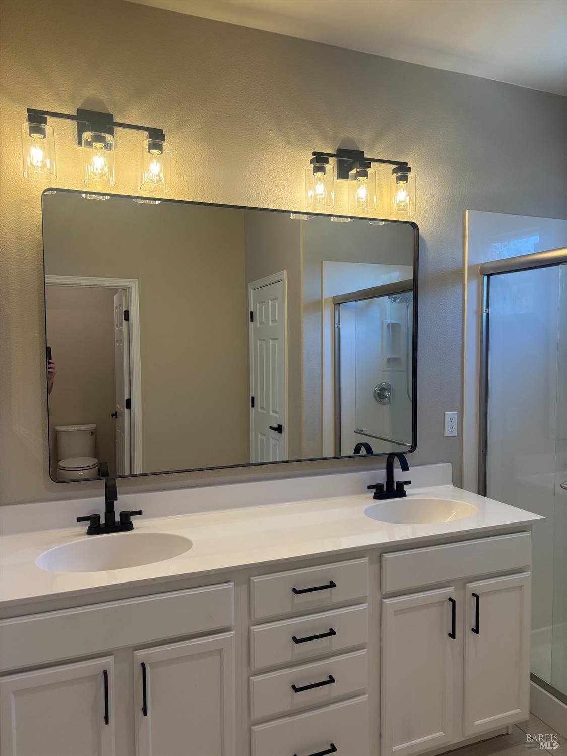 5114 Kolton Place Rohnert Park, CA 94928 - Photo 15 of 37 a bathroom with a sink and a mirror