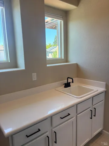 a room with a window and a sink