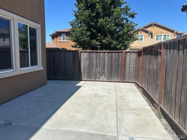 a view of outdoor space with wooden fence
