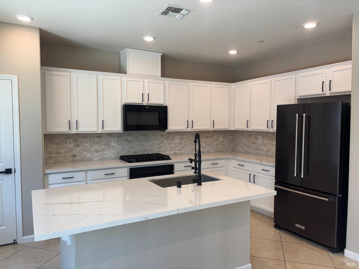 5114 Kolton Place Rohnert Park, CA 94928 - Photo 4 of 37 a kitchen with a refrigerator and a sink