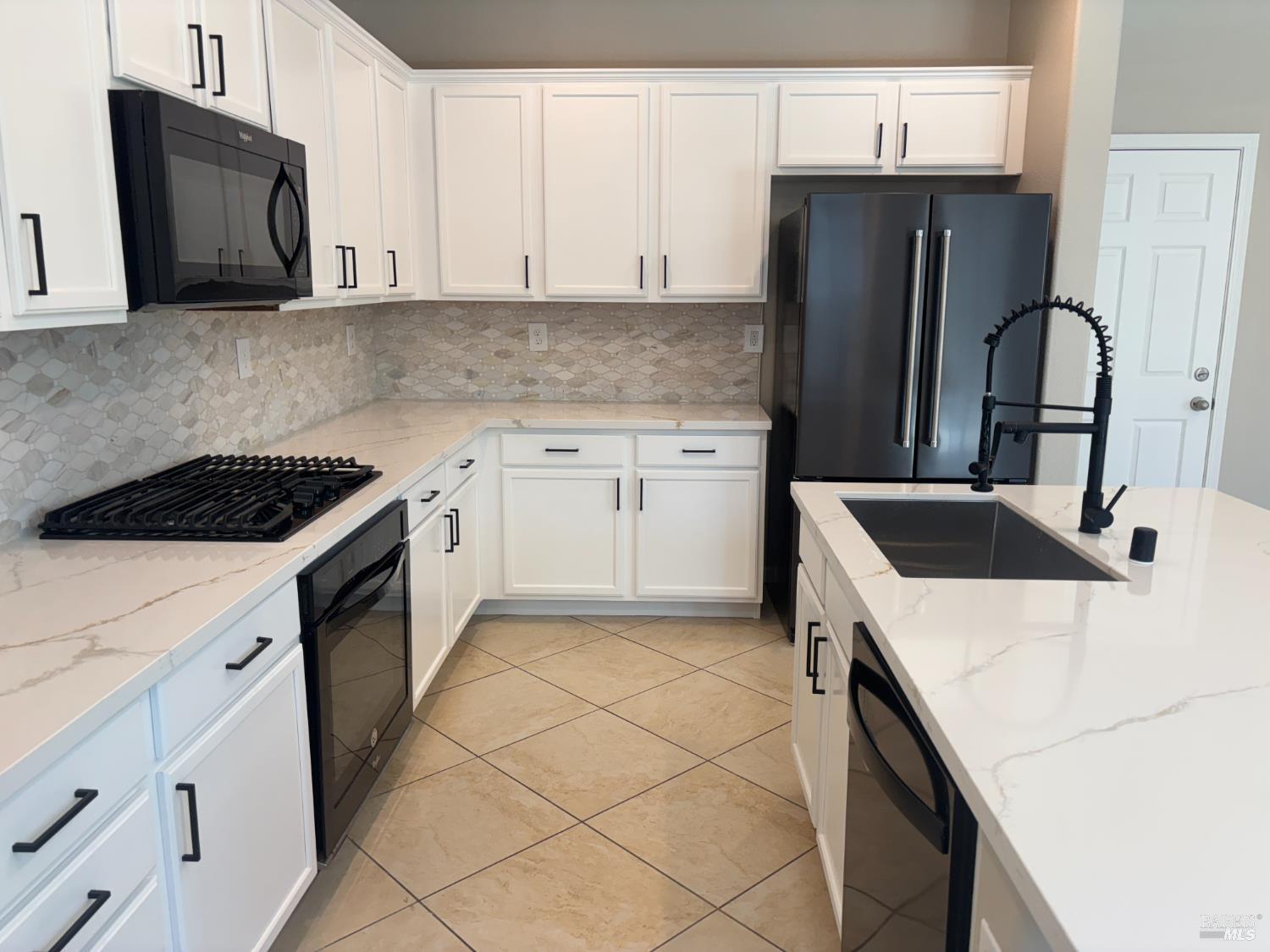 5114 Kolton Place Rohnert Park, CA 94928 - Photo 5 of 37 a kitchen with granite countertop a sink stove and refrigerator