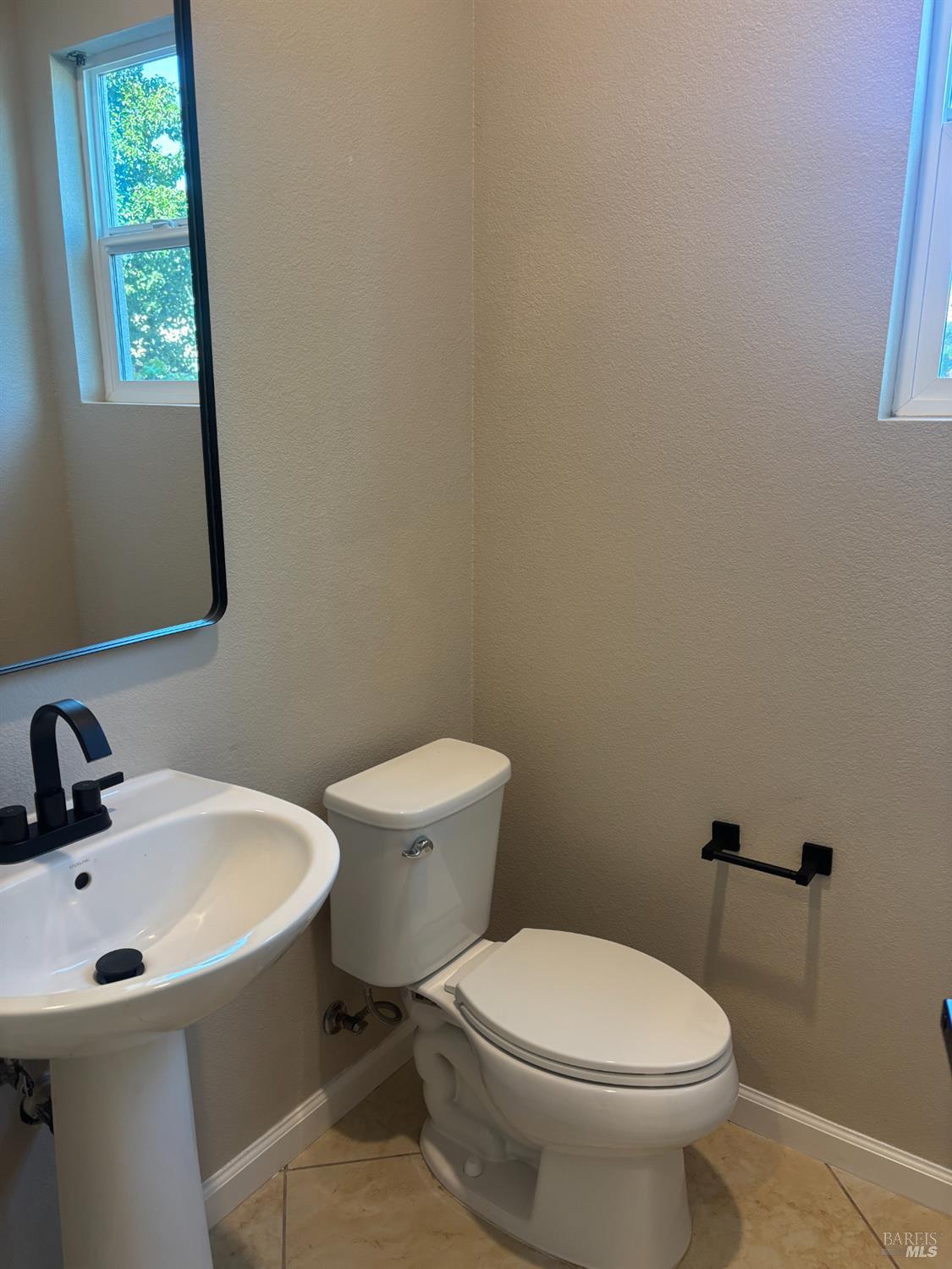 5114 Kolton Place Rohnert Park, CA 94928 - Photo 9 of 37 a white toilet sitting next to a bathroom sink