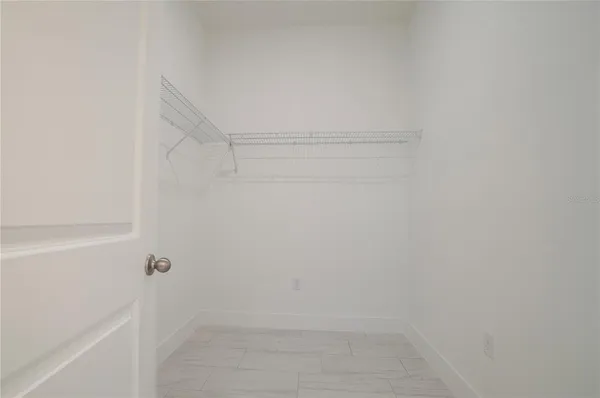 a view of an empty room with a garage