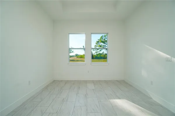 an empty room with windows