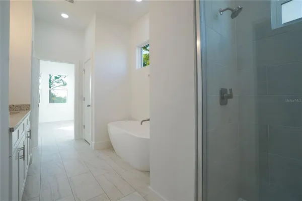 a white bath tub sitting in a bathroom