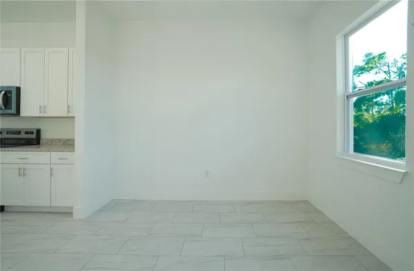 a view of cabinets and window