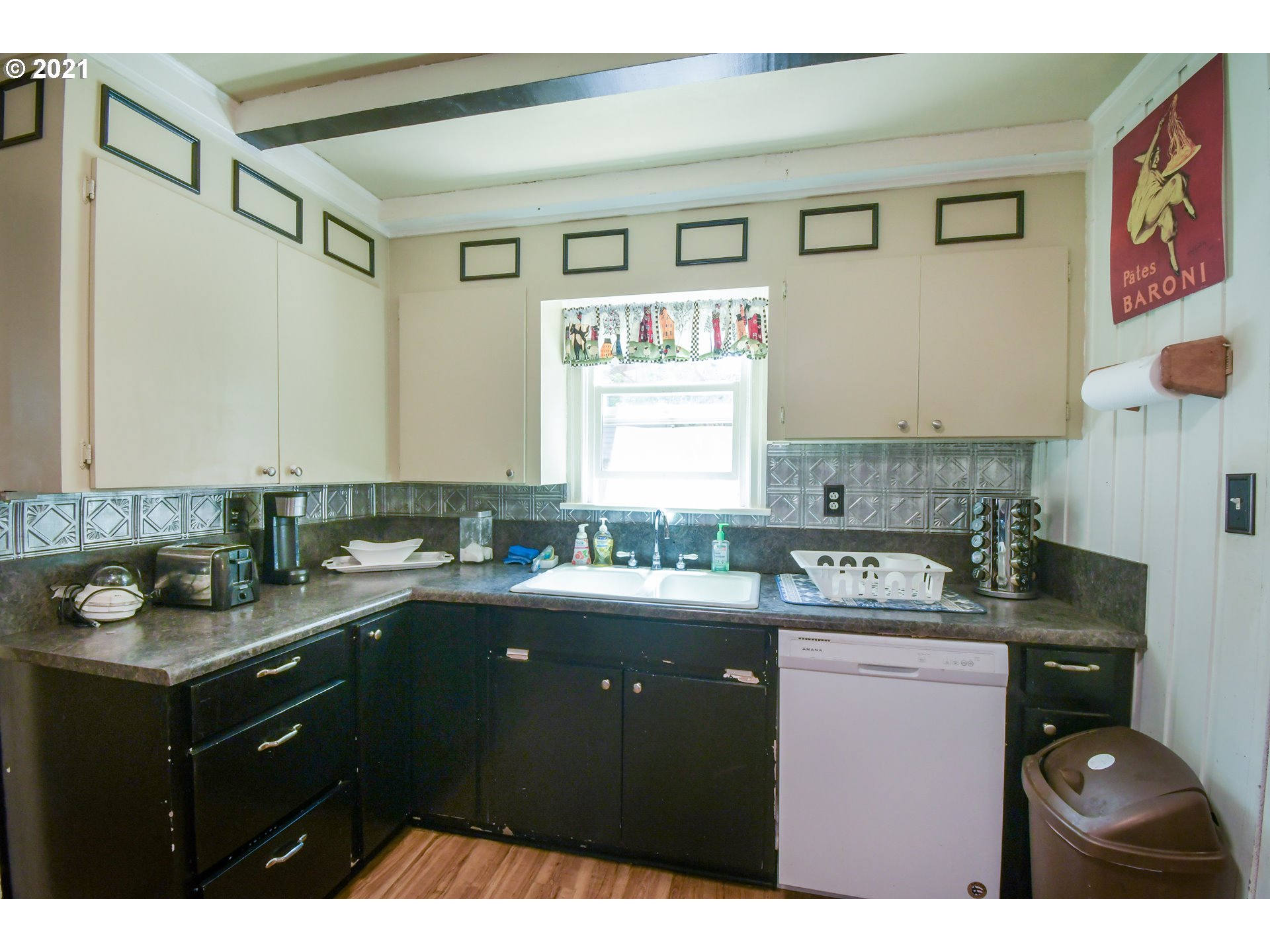 2266 5th Street Springfield, OR 97477 - Photo 3 of 21 a kitchen with a sink a stove and cabinets