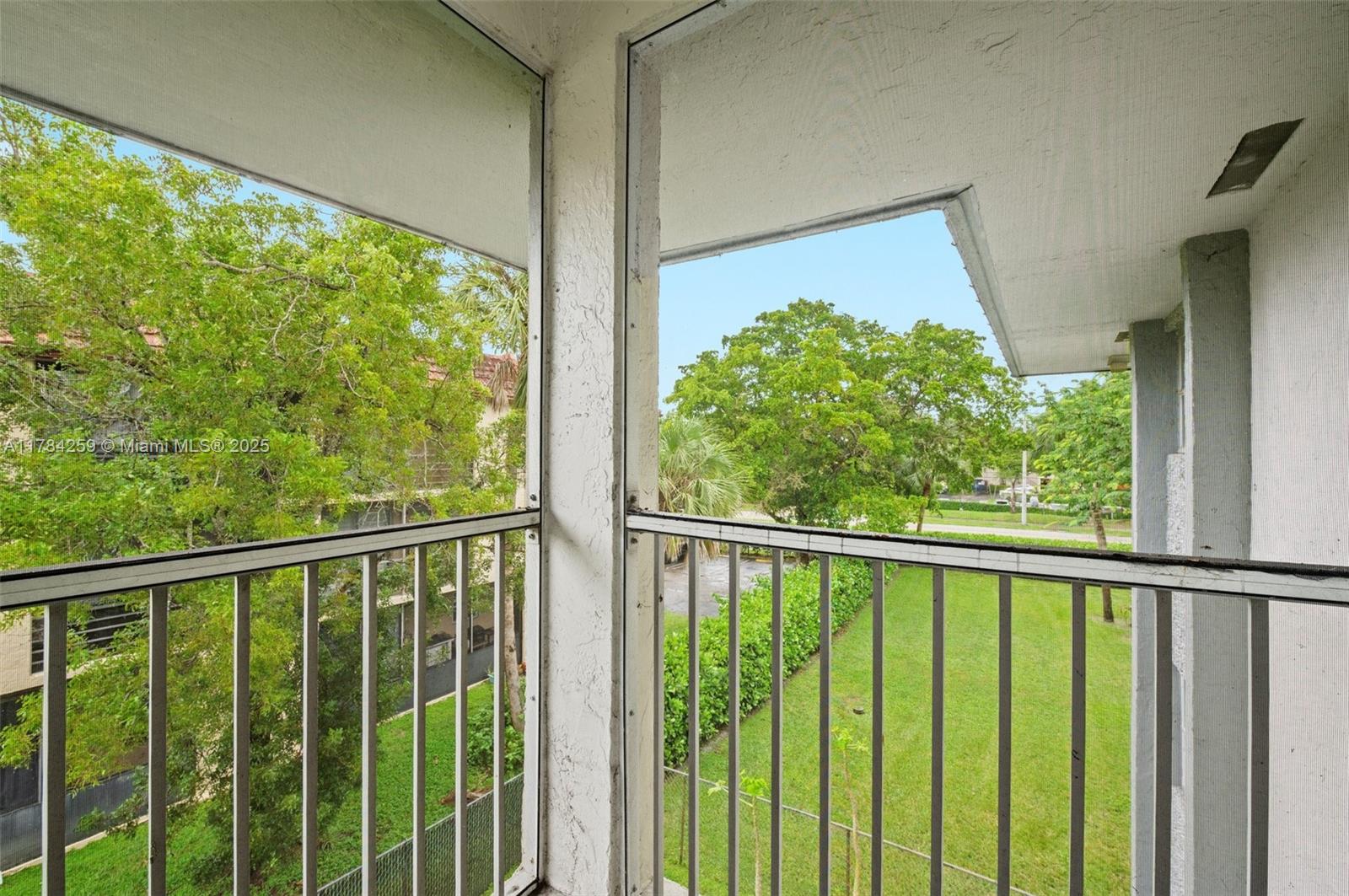 3000 Riverside Drive, Unit 3091 Coral Springs, FL 33065 - Photo 20 of 25 Screened Balcony Garden View
