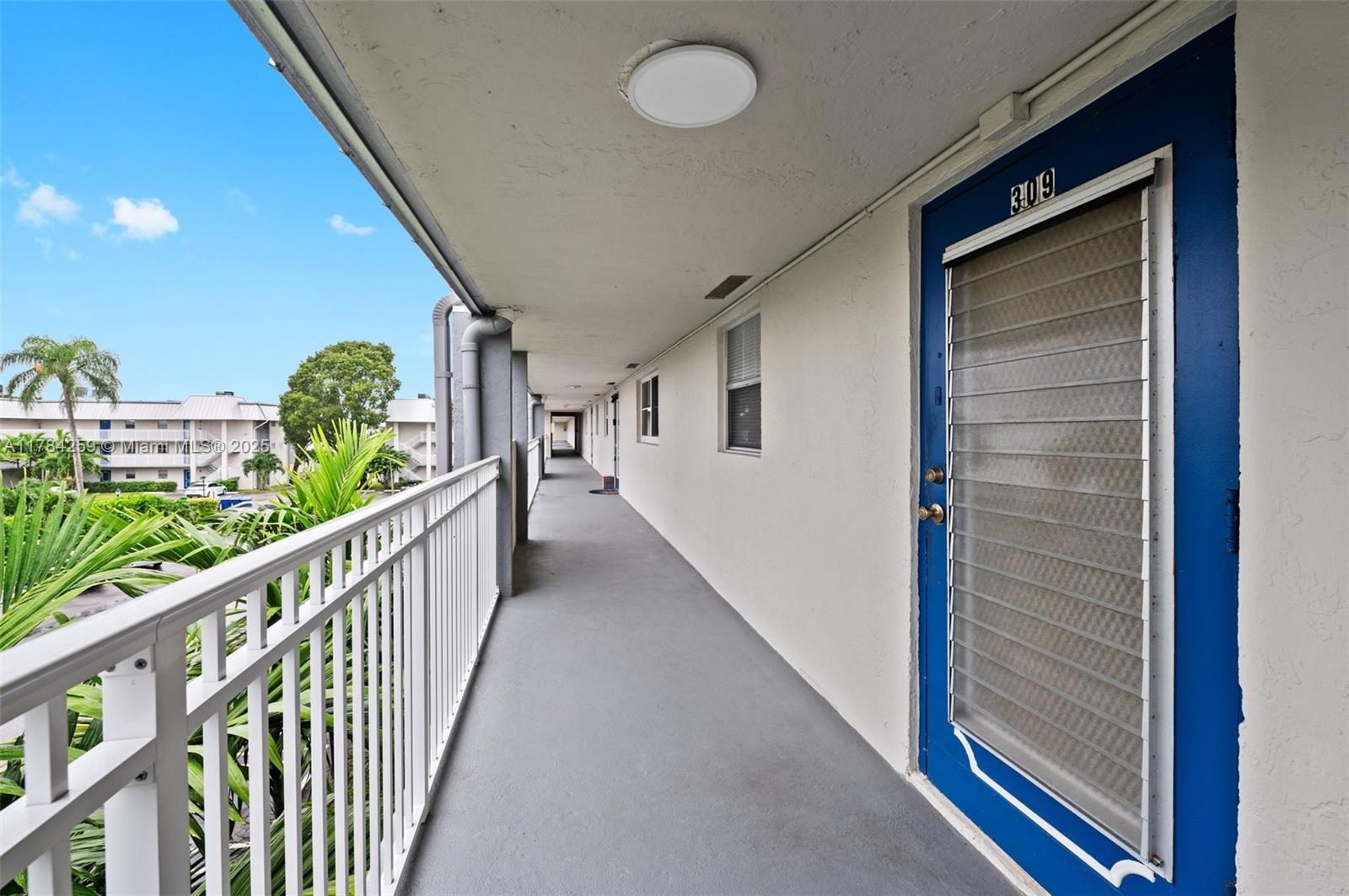 3000 Riverside Drive, Unit 3091 Coral Springs, FL 33065 - Photo 21 of 25 Front Entry Catwalk