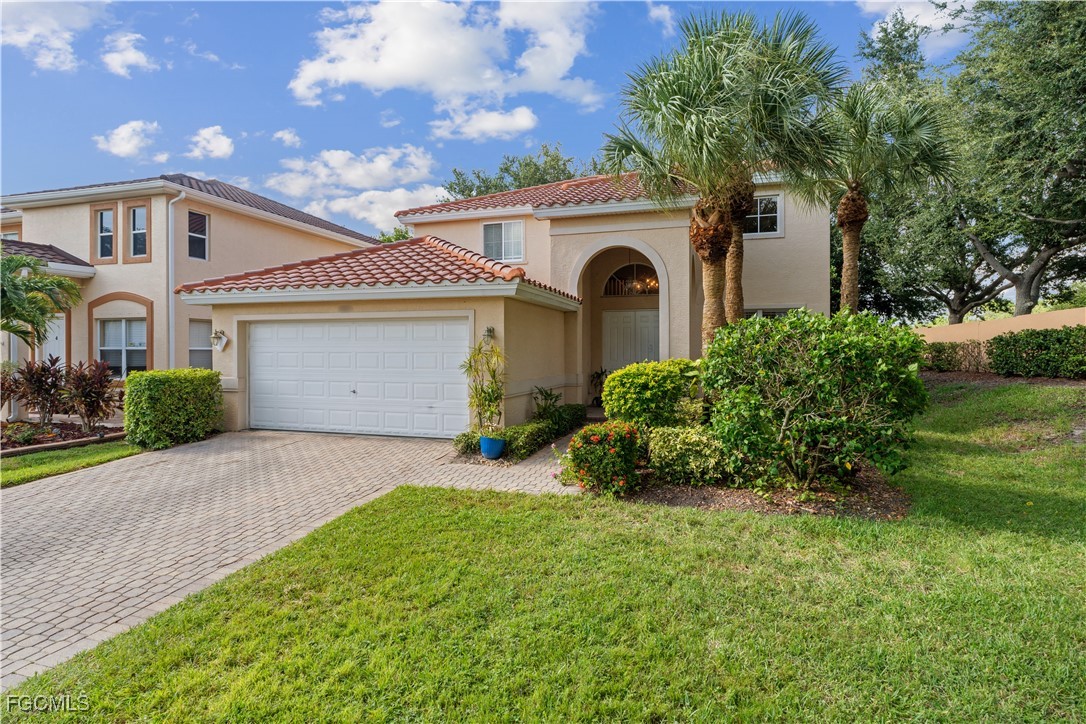 9475 Silver Pine Loop Fort Myers, FL 33967 - Photo 1 of 34 a view of backyard of house with green space