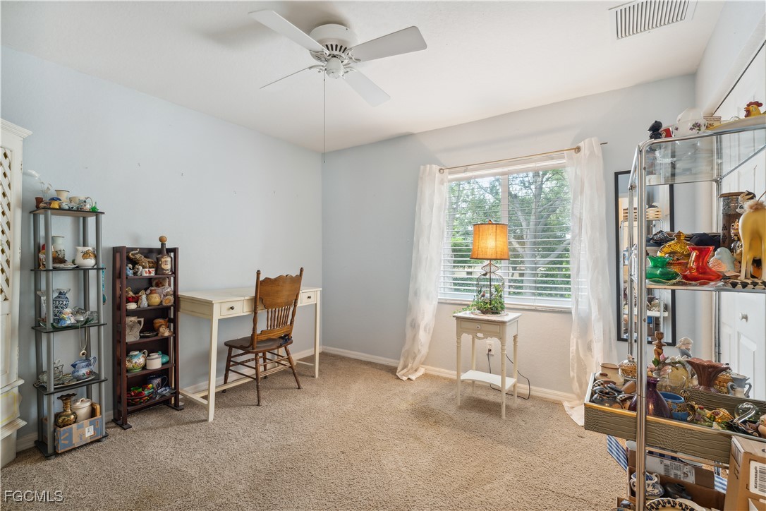 9475 Silver Pine Loop Fort Myers, FL 33967 - Photo 13 of 34 a view of a workspace with furniture and a window