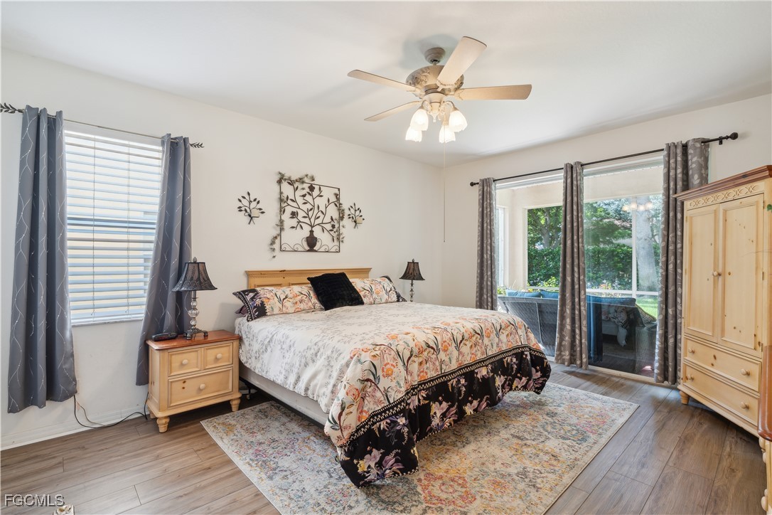 9475 Silver Pine Loop Fort Myers, FL 33967 - Photo 15 of 34 a bedroom with a large bed and a window