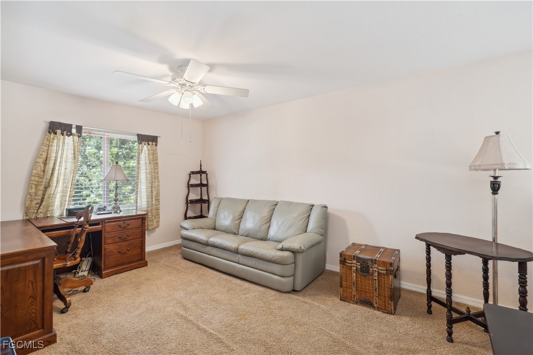 9475 Silver Pine Loop Fort Myers, FL 33967 - Photo 19 of 34 a living room with furniture and a window