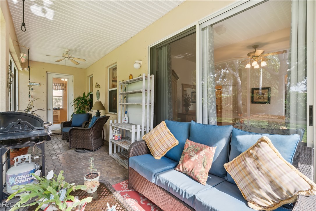 9475 Silver Pine Loop Fort Myers, FL 33967 - Photo 21 of 34 a living room with furniture and a large window