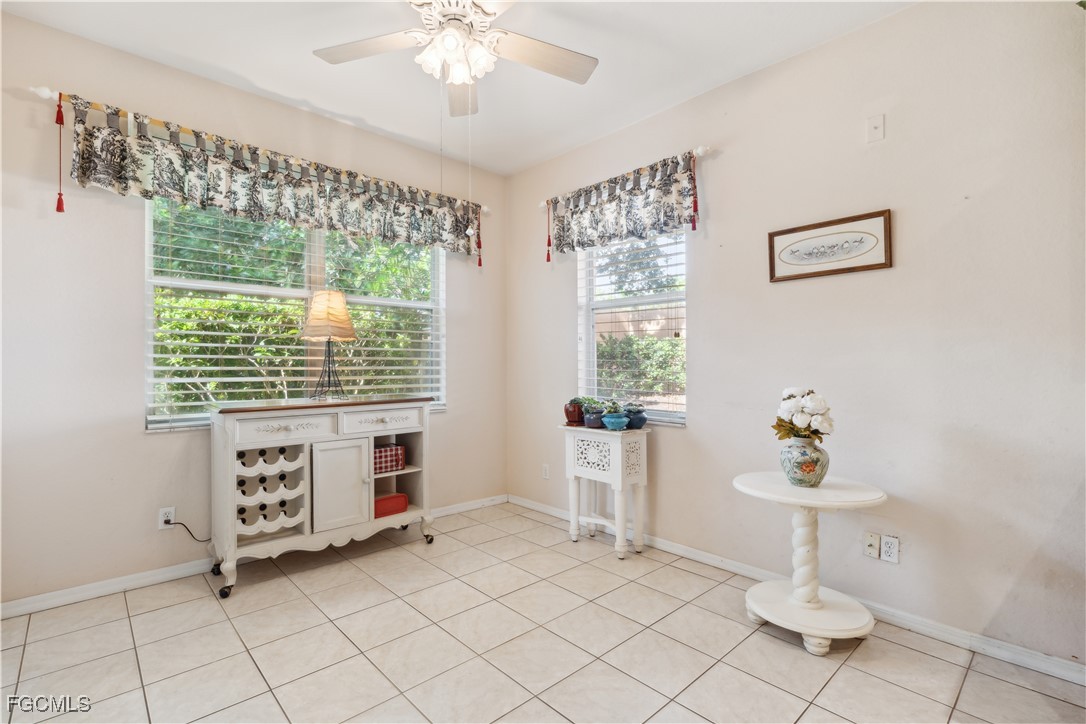9475 Silver Pine Loop Fort Myers, FL 33967 - Photo 23 of 34 a living room with furniture and a table