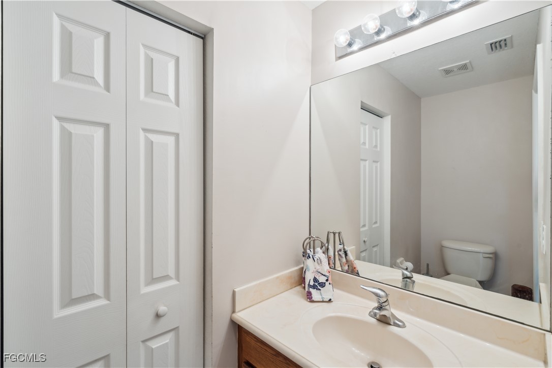 9475 Silver Pine Loop Fort Myers, FL 33967 - Photo 26 of 34 a bathroom with a sink and a mirror