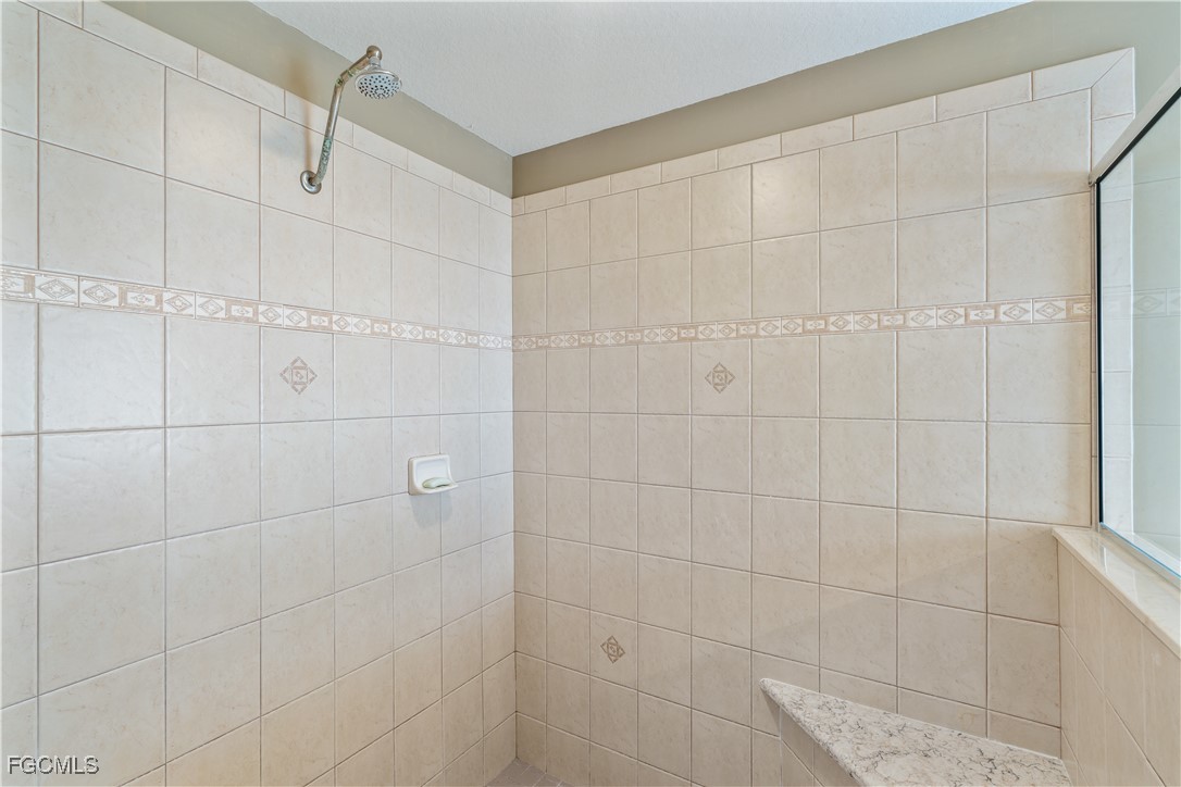 9475 Silver Pine Loop Fort Myers, FL 33967 - Photo 28 of 34 a bathroom with a shower