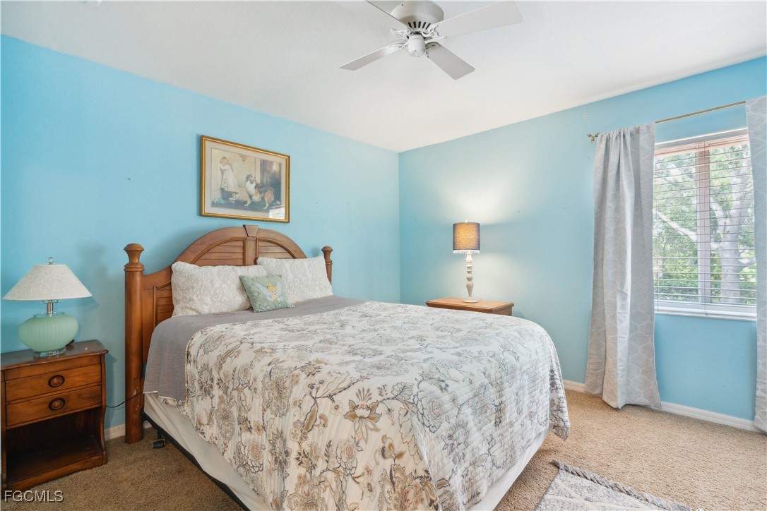 9475 Silver Pine Loop Fort Myers, FL 33967 - Photo 30 of 34 a bedroom with a bed and a window